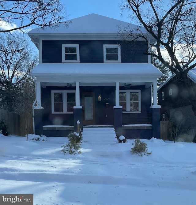 view of front facade featuring covered porch and fence