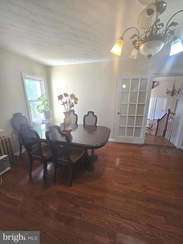 dining area featuring baseboards and wood finished floors