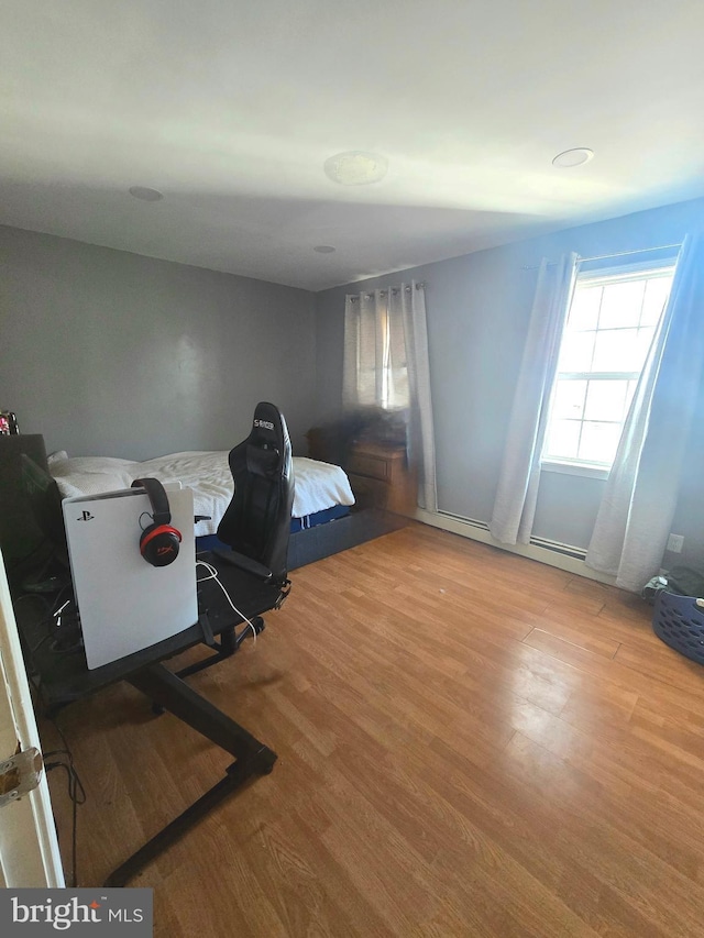 bedroom featuring wood finished floors