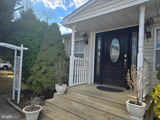 property entrance with covered porch