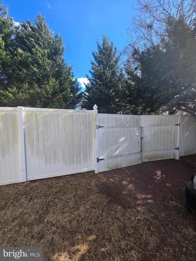 view of yard with a gate and fence