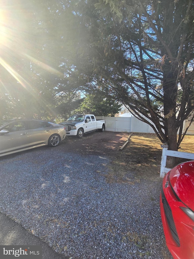 view of front of property featuring fence