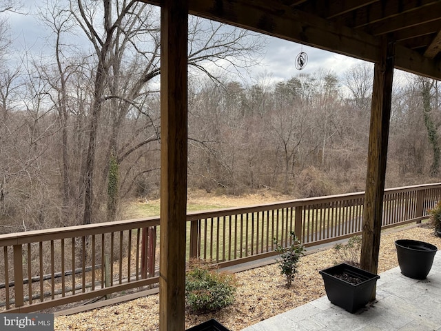 wooden deck featuring fence and an outdoor fire pit