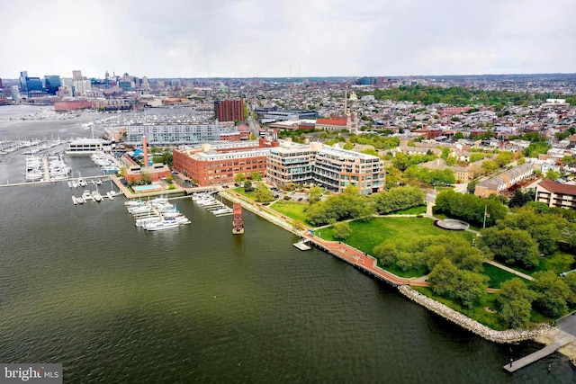 drone / aerial view featuring a water view and a view of city
