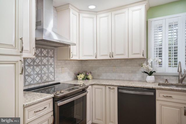 kitchen featuring range with electric cooktop, a sink, tasteful backsplash, wall chimney range hood, and dishwashing machine