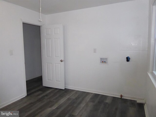 washroom featuring hookup for a washing machine, laundry area, dark wood finished floors, and baseboards