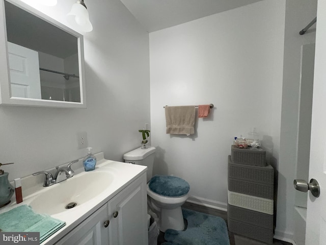 bathroom with toilet and vanity