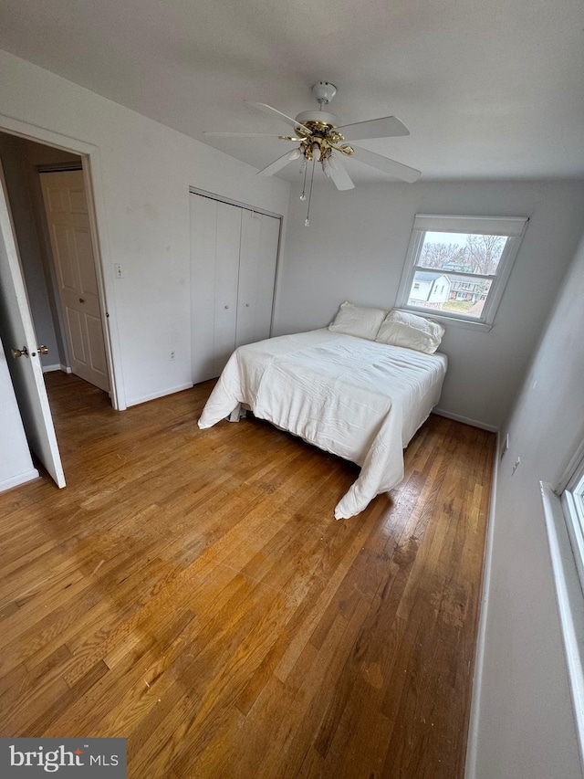 bedroom featuring a closet, ceiling fan, and hardwood / wood-style flooring