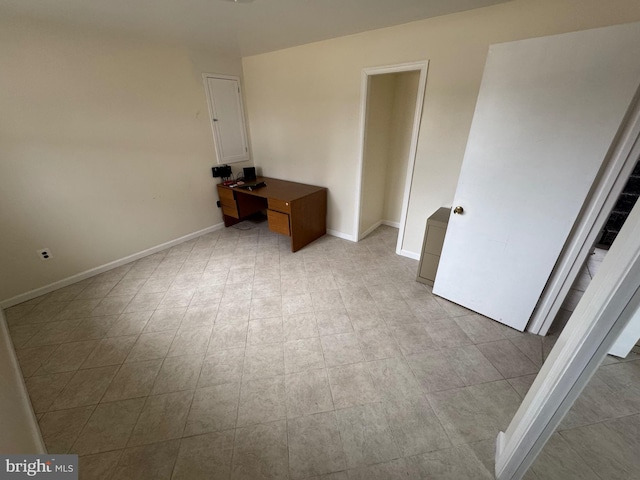 unfurnished bedroom with baseboards