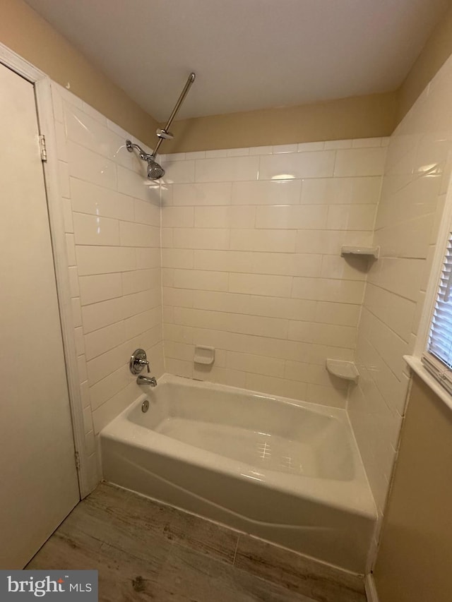 full bathroom featuring shower / bathing tub combination and wood finished floors