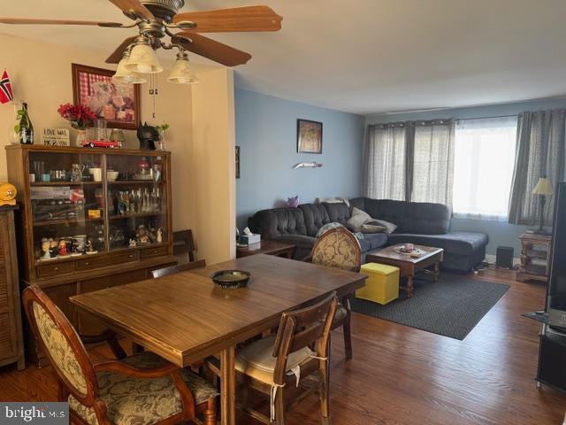 dining room featuring a ceiling fan and wood finished floors