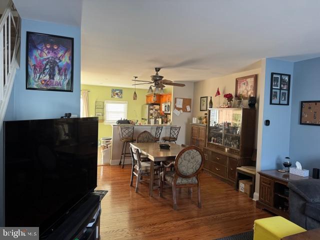 dining room featuring ceiling fan and wood finished floors