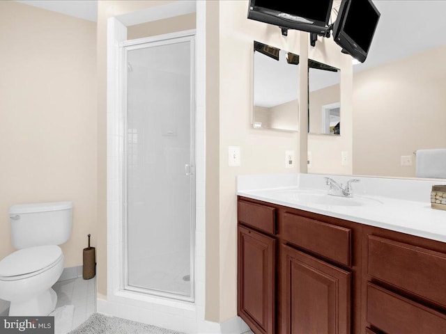 bathroom with tile patterned floors, a stall shower, toilet, and vanity