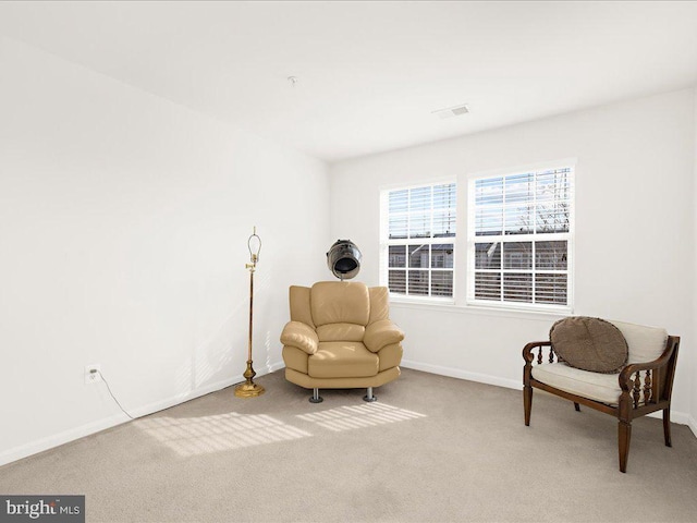 sitting room with carpet, visible vents, and baseboards