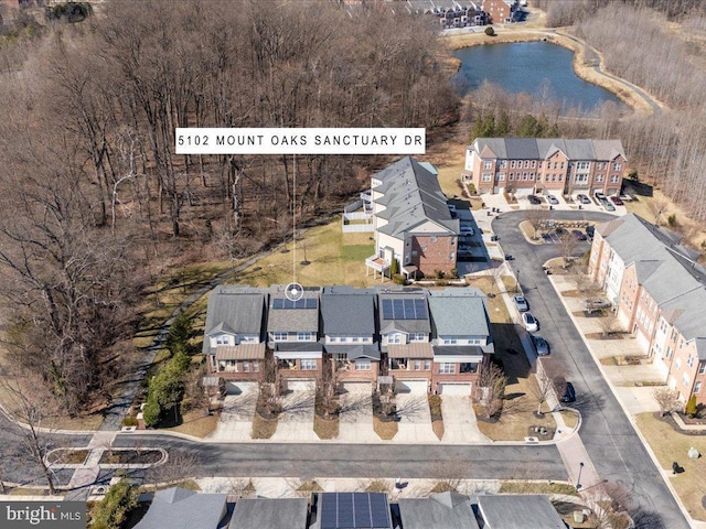 aerial view with a water view and a residential view