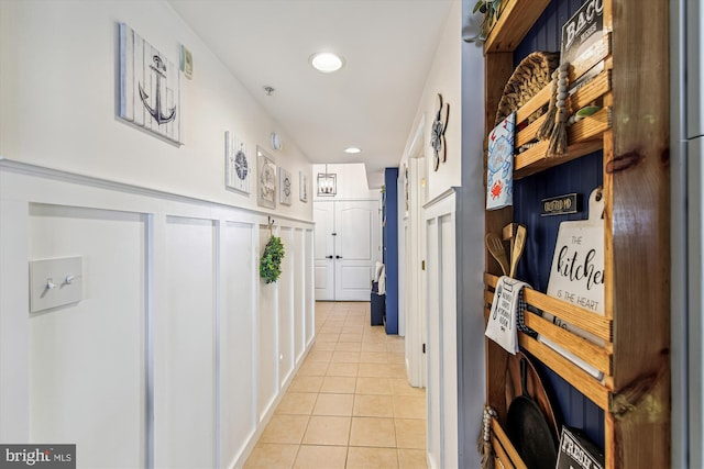 corridor featuring light tile patterned floors and recessed lighting