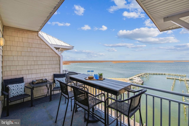 balcony featuring a water view