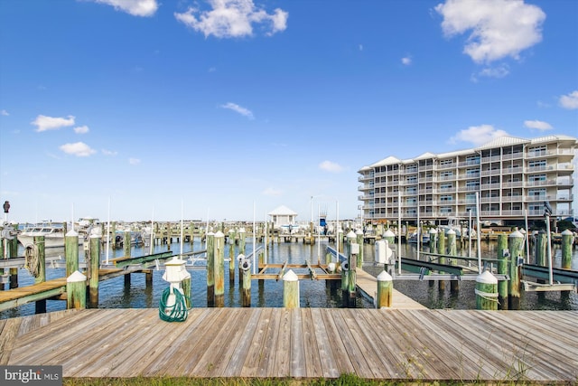 dock area with a water view and boat lift