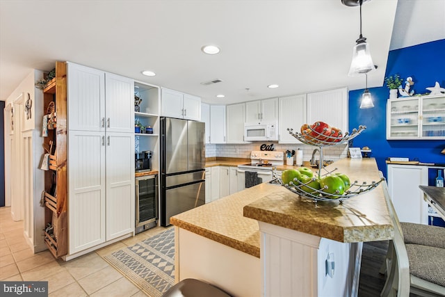 kitchen with visible vents, wine cooler, white appliances, white cabinets, and light tile patterned floors