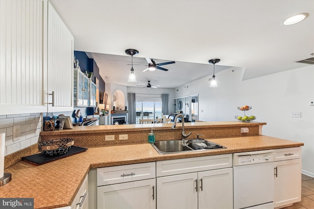 kitchen featuring white cabinetry, ceiling fan, a sink, light countertops, and dishwasher