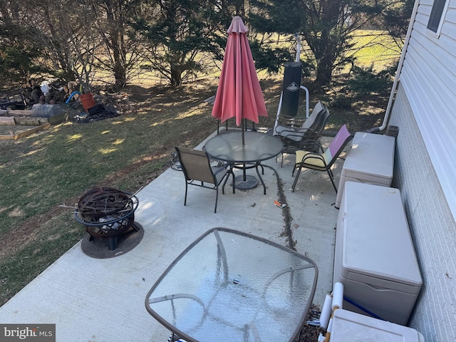 view of patio / terrace with an outdoor fire pit