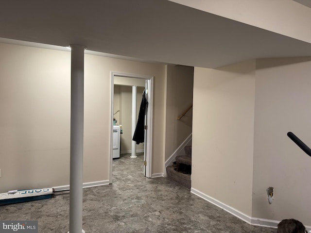 finished below grade area with washer / dryer, baseboards, and stairway