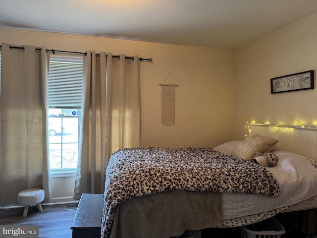 bedroom featuring wood finished floors