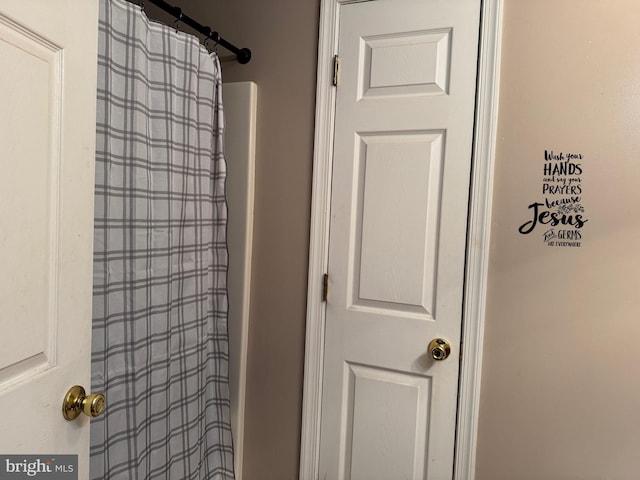 bathroom with a shower with shower curtain