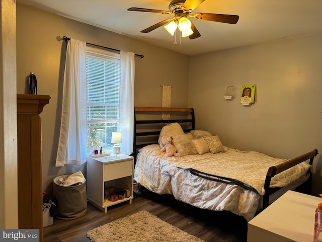 bedroom with ceiling fan and wood finished floors