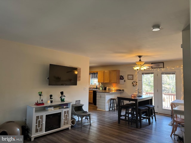 dining space featuring dark wood finished floors and a ceiling fan