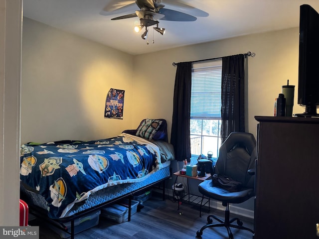 bedroom with ceiling fan and wood finished floors