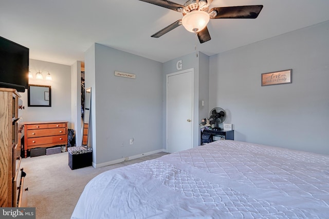 bedroom featuring ceiling fan, carpet flooring, and baseboards
