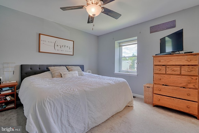 bedroom featuring baseboards, ceiling fan, and carpet floors