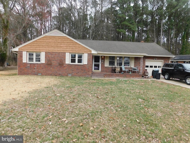 single story home with a front lawn, an attached garage, brick siding, and crawl space