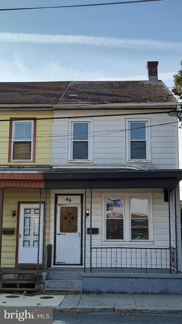 view of property with covered porch