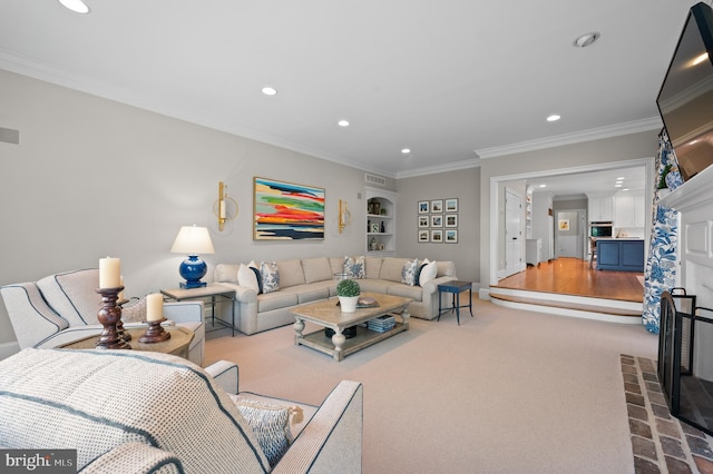 living room with recessed lighting, carpet floors, a fireplace, and crown molding