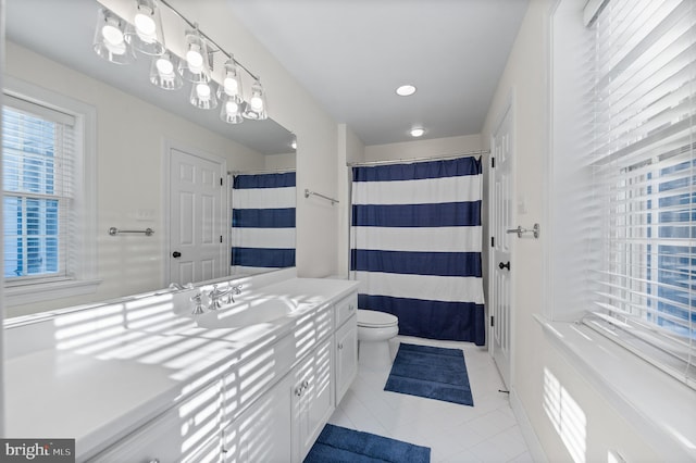 full bathroom with a shower with shower curtain, toilet, vanity, and tile patterned flooring