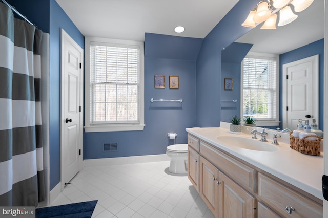 bathroom with tile patterned floors, visible vents, toilet, baseboards, and vanity