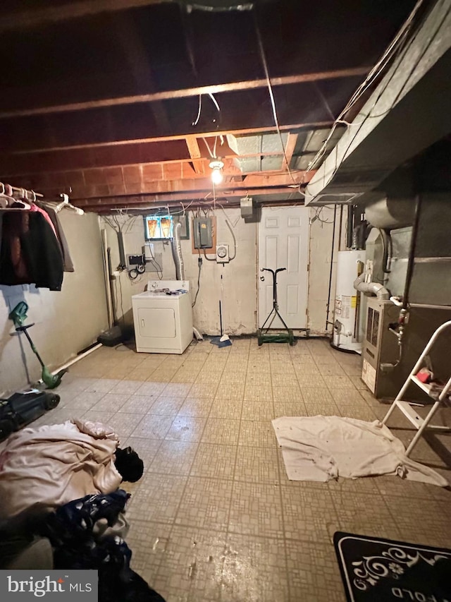 unfinished below grade area with washer / dryer, gas water heater, and heating unit