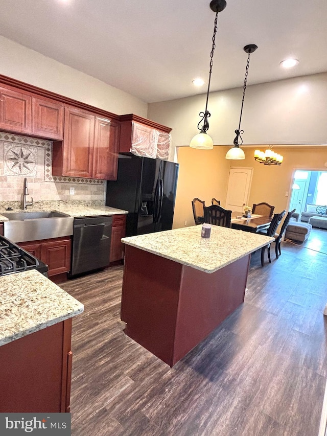 kitchen with dark wood-style floors, a kitchen island, decorative backsplash, stainless steel dishwasher, and black refrigerator with ice dispenser