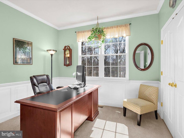 office area with crown molding, light carpet, and wainscoting