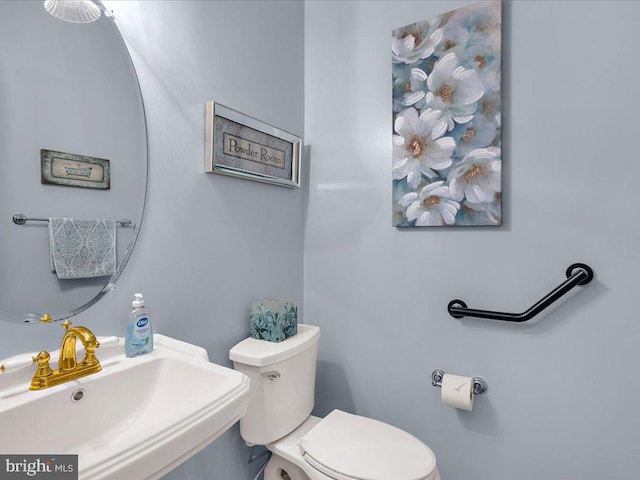 bathroom with a sink and toilet