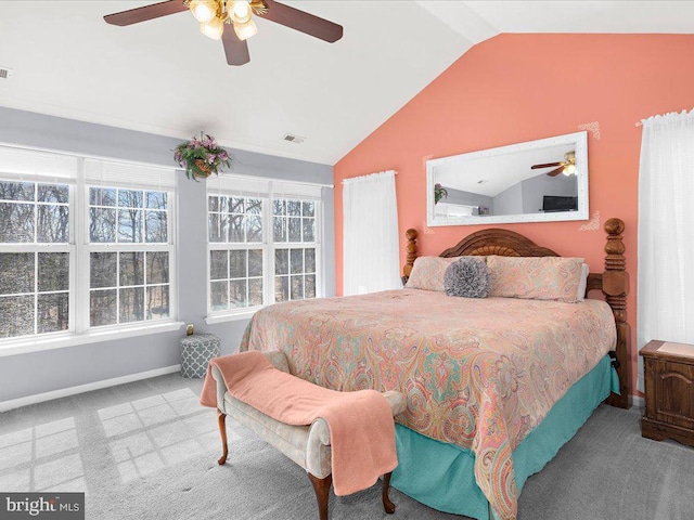 bedroom featuring visible vents, a ceiling fan, baseboards, carpet flooring, and lofted ceiling