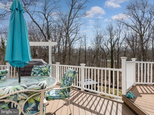 wooden deck with outdoor dining space