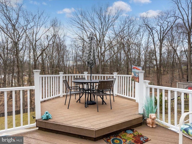 wooden deck with outdoor dining area