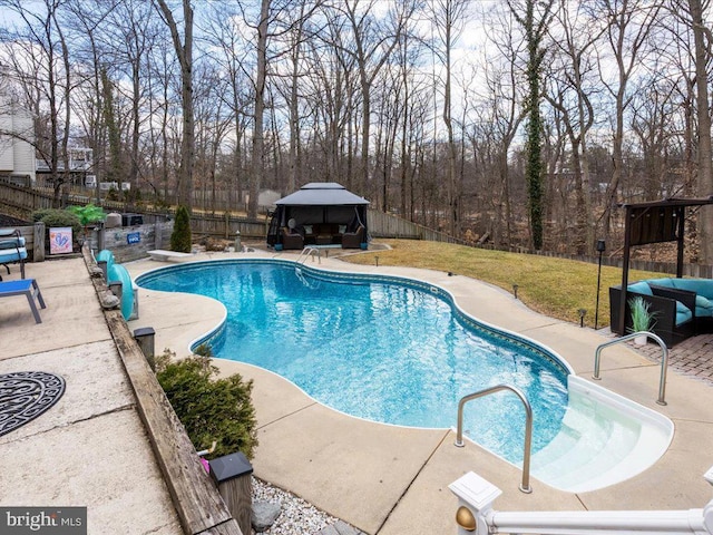 view of pool with a fenced backyard, a gazebo, a yard, a fenced in pool, and a patio area