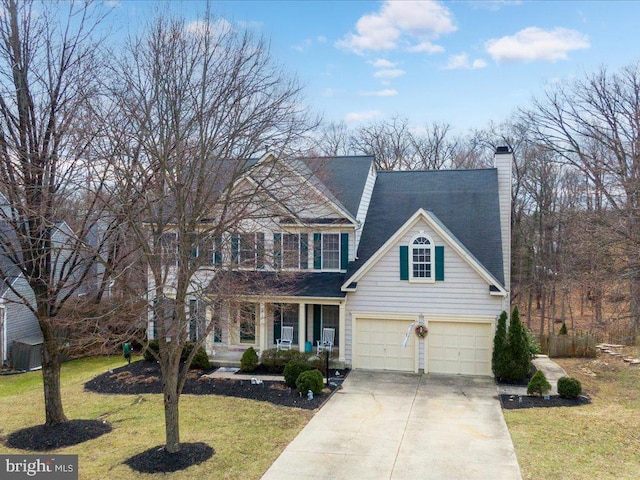 traditional-style home featuring driveway, an attached garage, covered porch, a chimney, and a front lawn