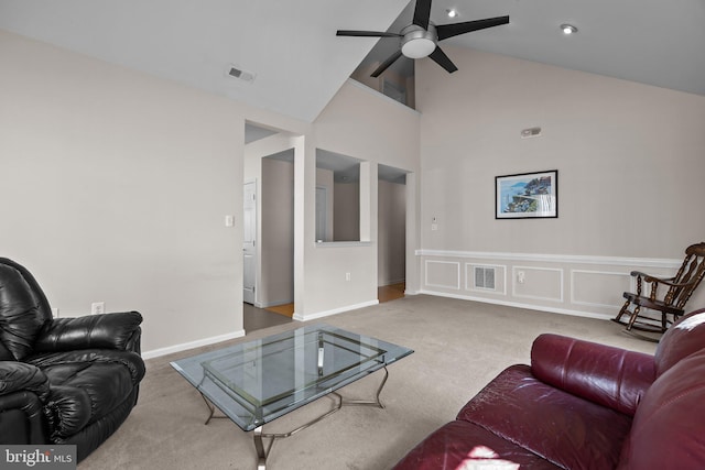 living room with a ceiling fan, baseboards, carpet, visible vents, and high vaulted ceiling