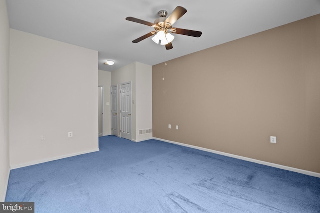 unfurnished bedroom with visible vents, a ceiling fan, baseboards, and carpet floors