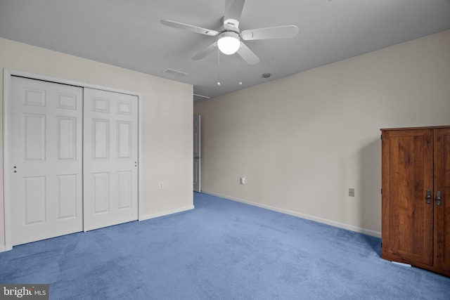 unfurnished bedroom with baseboards, visible vents, carpet floors, ceiling fan, and a closet